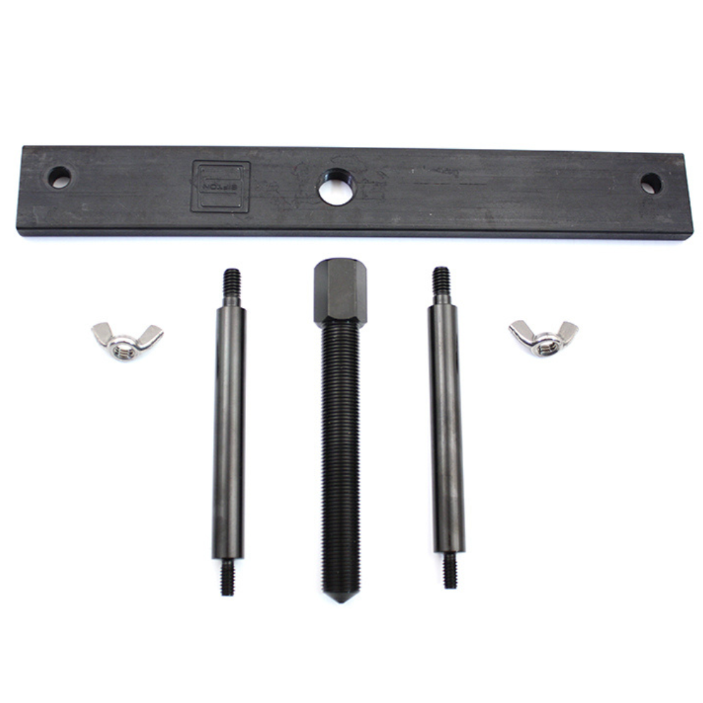 Wyatt Gatling Clutch Hub Spring Compressor for 1971-1984 Harley-Davidson Ironhead—black metal tool set with flat bar, central bolt, two rods, and wing nuts—by Wyatt Gatling, displayed on a white background.