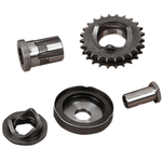 Five assorted metal mechanical parts, including gears and cylindrical components from the Drag Specialties Compensating Sprocket Kit for 1994-2006 Harley-Davidson Big Twin models, arranged separately on a white background.