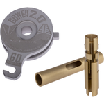 Two metal motorcycle parts from Müller Motorcycle are shown on a white background: a round, gray component labeled “Power Clutch 2.0” and a cylindrical, gold component with slots and cutouts. The Müller Power Clutch 2.0 for 2017-Up Harley-Davidson Big Twin is designed to improve Harley-Davidson clutch systems by providing easier clutch lever operation and enhanced riding comfort.