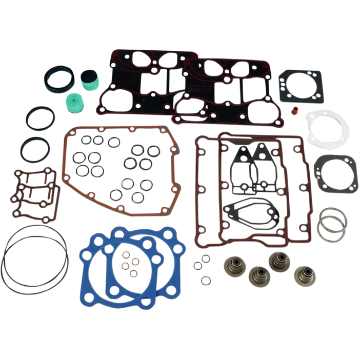 A James Top End Gasket Kit for Harley-Davidson Twin Cam featuring an assortment of gaskets, O-rings, and seals in various shapes, sizes, and materials laid out on a white surface.