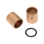 Two cylindrical metal kicker cover bushings and one black rubber O-ring from a Drag Specialties Kicker Cover Bushing and Seal Kit for 1936-1986 Harley-Davidson Big Twin.
