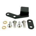 A black piece of metal with a screw, bolt, and TC Bros. Chain Slider 2006-2017 Harley Dyna from TC Bros.