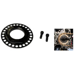 A circular metal flange with multiple holes and a threaded center rests beside two small screws on a plain white background, akin to the precision found in the Moto Iron® Billet Sprocket Lock Nut for Big Twin/Dyna 93-06 (except 06 Dyna) or Sportster 93-UP models.