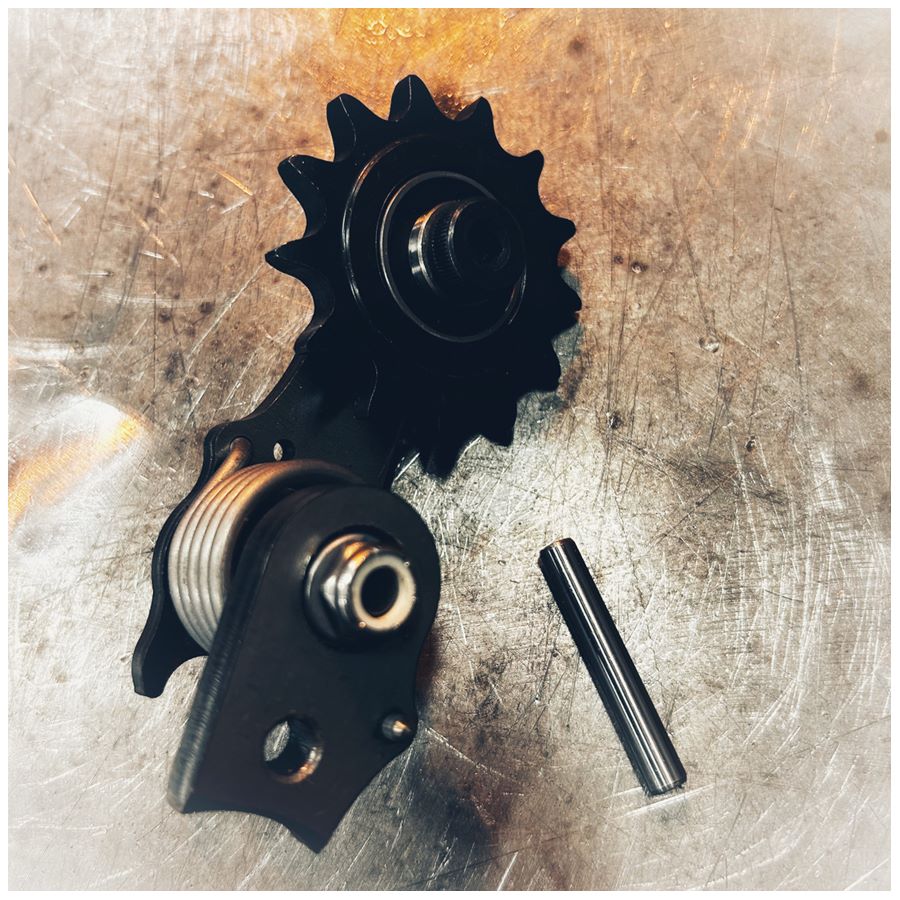 A Single Sided Weld On Chain Tensioner - 530 Sprocket by Monster Craftsman on a metal surface.