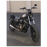 A black custom Invisivin Magnetic Vin Sticker Cover - 2011+ Sportster with dual split stickers 15" motorcycle parked on an asphalt surface outside a building during dusk.
