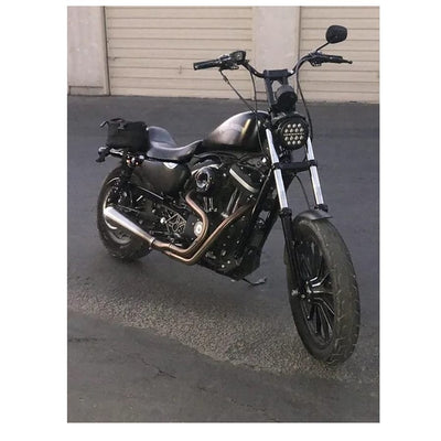 A black custom Invisivin Magnetic Vin Sticker Cover - 2011+ Sportster with dual split stickers 15" motorcycle parked on an asphalt surface outside a building during dusk.