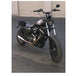 A black custom Invisivin Magnetic Vin Sticker Cover - 2011+ Sportster with dual split stickers 15" motorcycle parked on an asphalt surface outside a building during dusk.