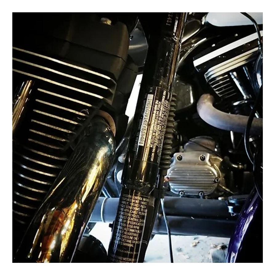 A close up of a motorcycle with an Invisivin Magnetic Vin Sticker Cover - 95-98 Dyna with stepped frame with dual split.