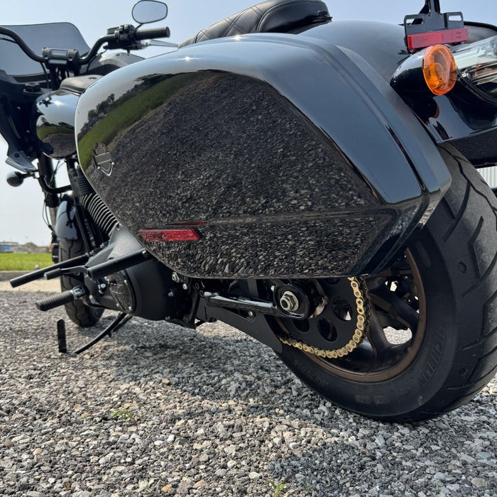 The TC Bros. Belt to Chain Drive Conversion Kit for 2018-Up Harley Davidson M8 Softail includes a large sprocket, small gear, hub, and hardware arranged on a white background—perfect for Milwaukee-Eight-powered models.