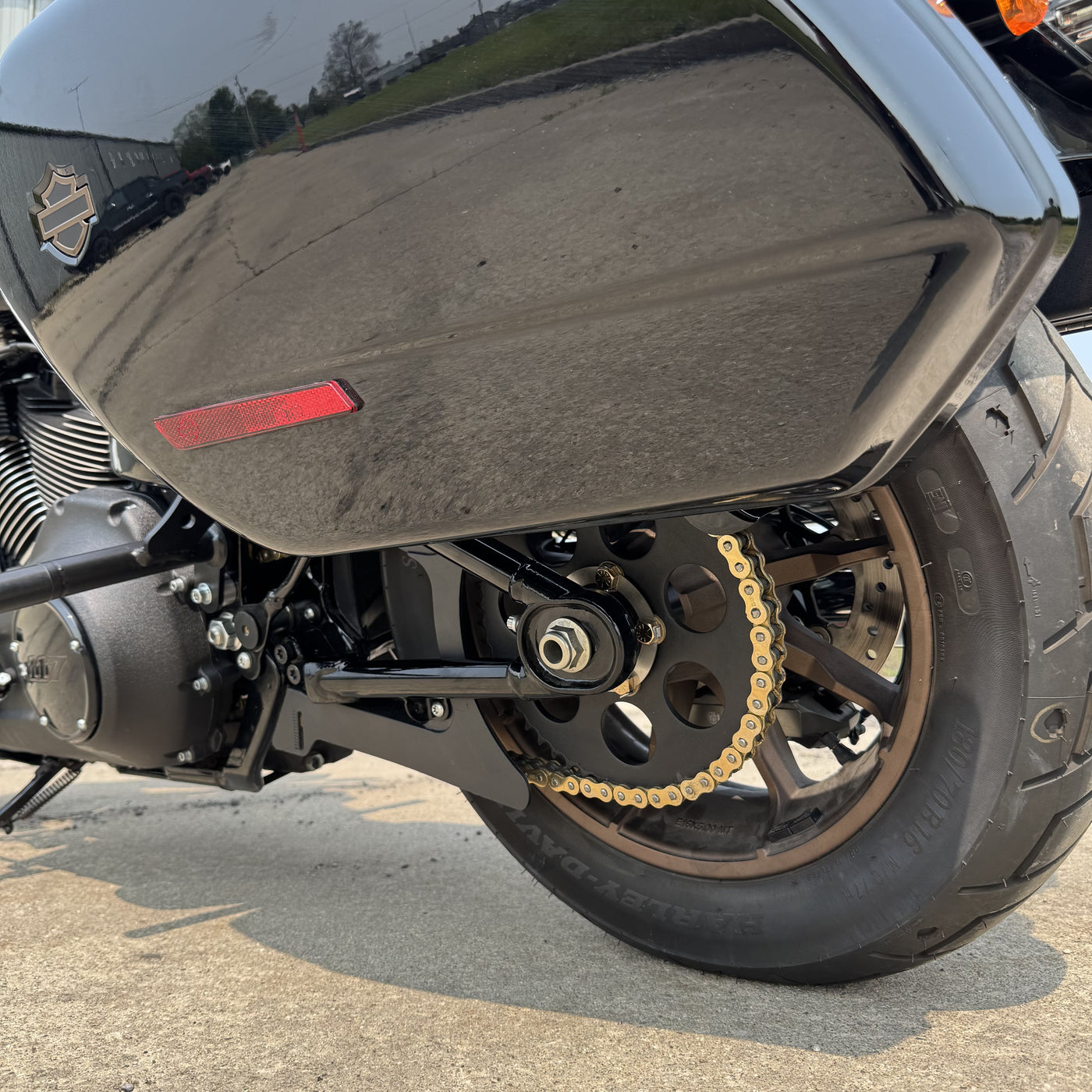The TC Bros. Belt to Chain Drive Conversion Kit for 2018-Up Harley Davidson M8 Softail includes a large sprocket, small gear, hub, and hardware arranged on a white background—perfect for Milwaukee-Eight-powered models.