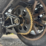 The TC Bros. Belt to Chain Drive Conversion Kit for 2018-Up Harley Davidson M8 Softail includes a large sprocket, small gear, hub, and hardware arranged on a white background—perfect for Milwaukee-Eight-powered models.