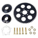 The TC Bros. Belt to Chain Drive Conversion Kit for 2018-Up Harley Davidson M8 Softail includes a large sprocket, small gear, hub, and hardware arranged on a white background—perfect for Milwaukee-Eight-powered models.