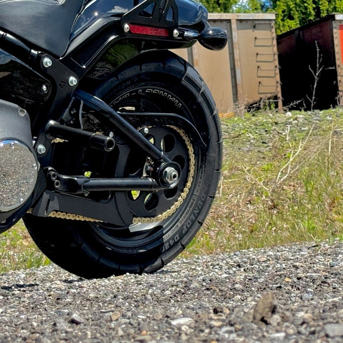 The TC Bros. Belt-to-Chain Drive Conversion Kit for 2018-Up Harley-Davidson Fat Bob includes two sprockets, gears, bolts, washers, and mounting hardware, all displayed on a white background.