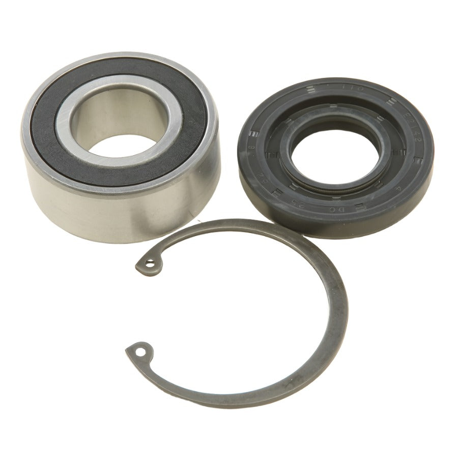 A All balls inner primary bearing and seal kit, a black rubber seal, and a retaining ring on a beige background.
