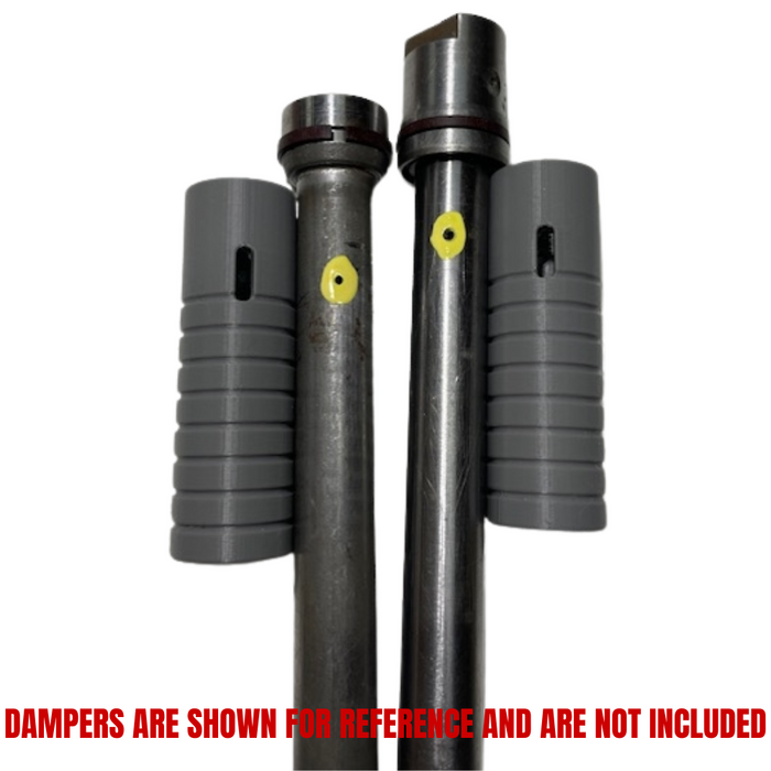 Two metal rods with grooves and yellow dots stand vertically, each flanked by a gray ridged sleeve—parts from the Hugh&