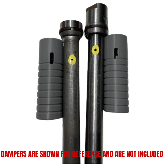 Two metal rods with grooves and yellow dots stand vertically, each flanked by a gray ridged sleeve—parts from the Hugh's Handbuilt Fork Lowering Kit for Yamaha XS650, designed to customize your motorcycle suspension.