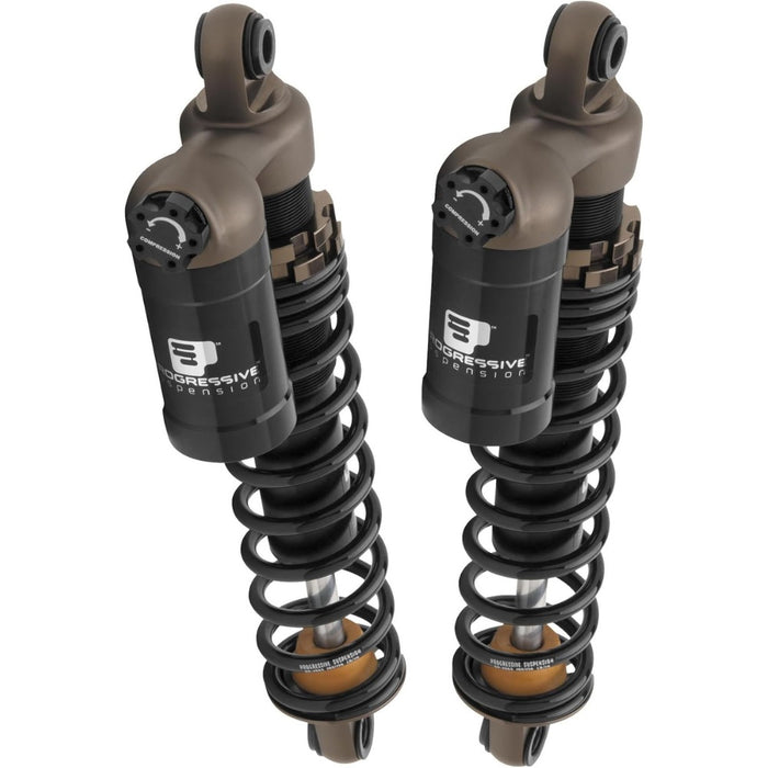 Two black and bronze Progressive Suspension 970 Series 13" shocks for 2004-2014 Harley-Davidson Sportster, shown upright on a white background—ideal as adjustable coil-over suspension for your motorcycle.