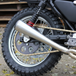 Burly Stiletto Shocks for 1986-2003 Harley-Davidson Sportster, including two black and red coil shocks, a metal spanner wrench, four bushings, four spacers, and a packet of lubricant.