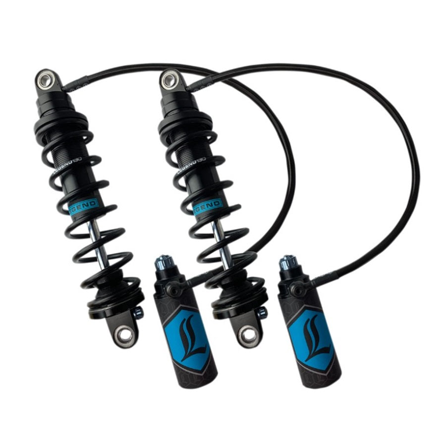A set of four REVO ARC Remote Reservoir Shocks with standard springs in black, designed for '99-08 FL Touring models by Legend Suspensions, with blue accents and connected hydraulic lines.