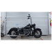 The Burly Slammer Lowering Shock for 2018-Up Harley-Davidson Softail features a coiled spring and "Burly" logo on the lower cylinder, shown here in black against a white background.