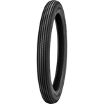 Four vintage-style car tires, including the Shinko 270 Super Classic Tire by Shinko, are displayed upright in a row on a white background, each with unique tread patterns and some featuring classic white sidewalls.