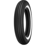 Four vintage-style car tires, including the Shinko 270 Super Classic Tire by Shinko, are displayed upright in a row on a white background, each with unique tread patterns and some featuring classic white sidewalls.