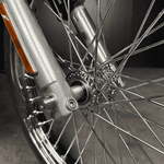 Two cylindrical, brushed metal bushings from the TC Bros. Spool Wheel Axle Spacer Kit for 1987-2007 Harley Davidson 39mm Narrow Glide Fork are shown side by side on a white background.