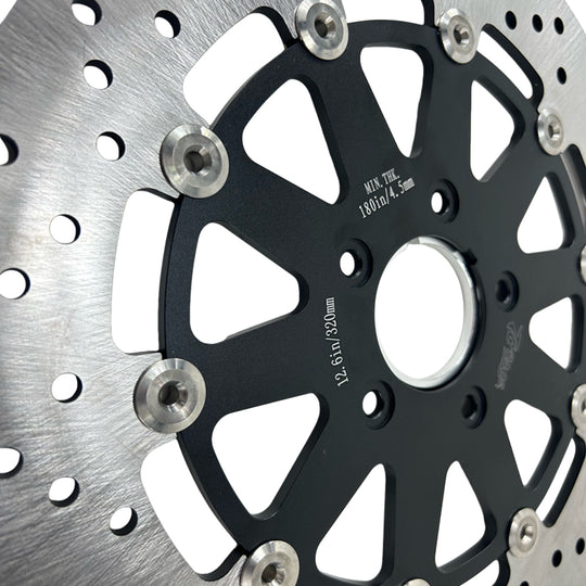 A TC Bros. 12.6in Oversized Front Floating Brake rotor for Harley Models, showcasing its corrosion resistance, placed against a white background.