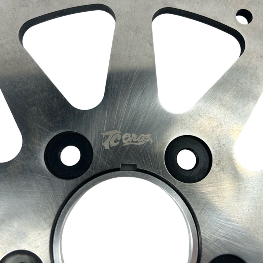 A TC Bros. 11.5in Profile™ Solid Mount Front Brake Rotor for 84-13 Harley Models Satin with holes.