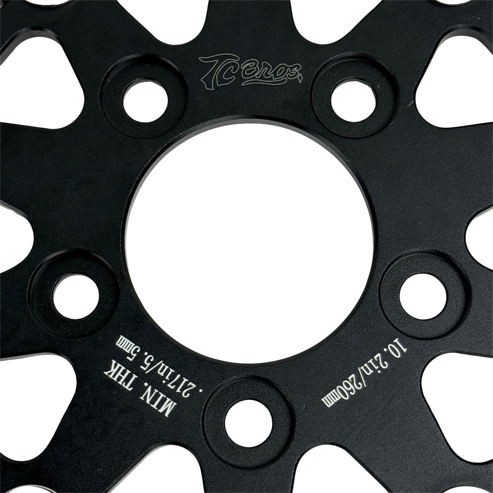 A close-up of the TC Bros. 10.25in Profile™ Rear Floating Brake Rotor, featuring a ventilated, perforated design with a black hub and silver ring—ideal for upgrading 2008-2022 Harley-Davidson Sportster brakes.