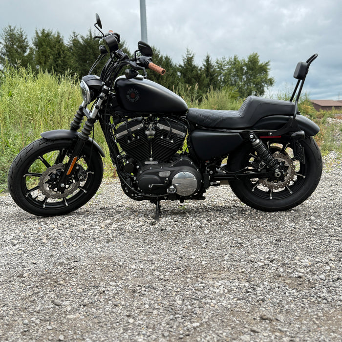 A close-up of the TC Bros. 10.25in Profile™ Rear Floating Brake Rotor, featuring a ventilated, perforated design with a black hub and silver ring—ideal for upgrading 2008-2022 Harley-Davidson Sportster brakes.