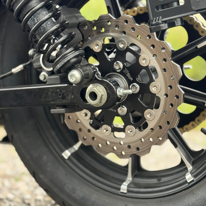 A close-up of the TC Bros. 10.25in Profile™ Rear Floating Brake Rotor, featuring a ventilated, perforated design with a black hub and silver ring—ideal for upgrading 2008-2022 Harley-Davidson Sportster brakes.