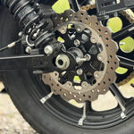 The TC Bros. 10.25in Profile™ Rear Floating Brake Rotor, featuring a perforated silver edge and black center hub, is the ideal upgrade for 2008-2022 Harley-Davidson Sportster rear brakes.