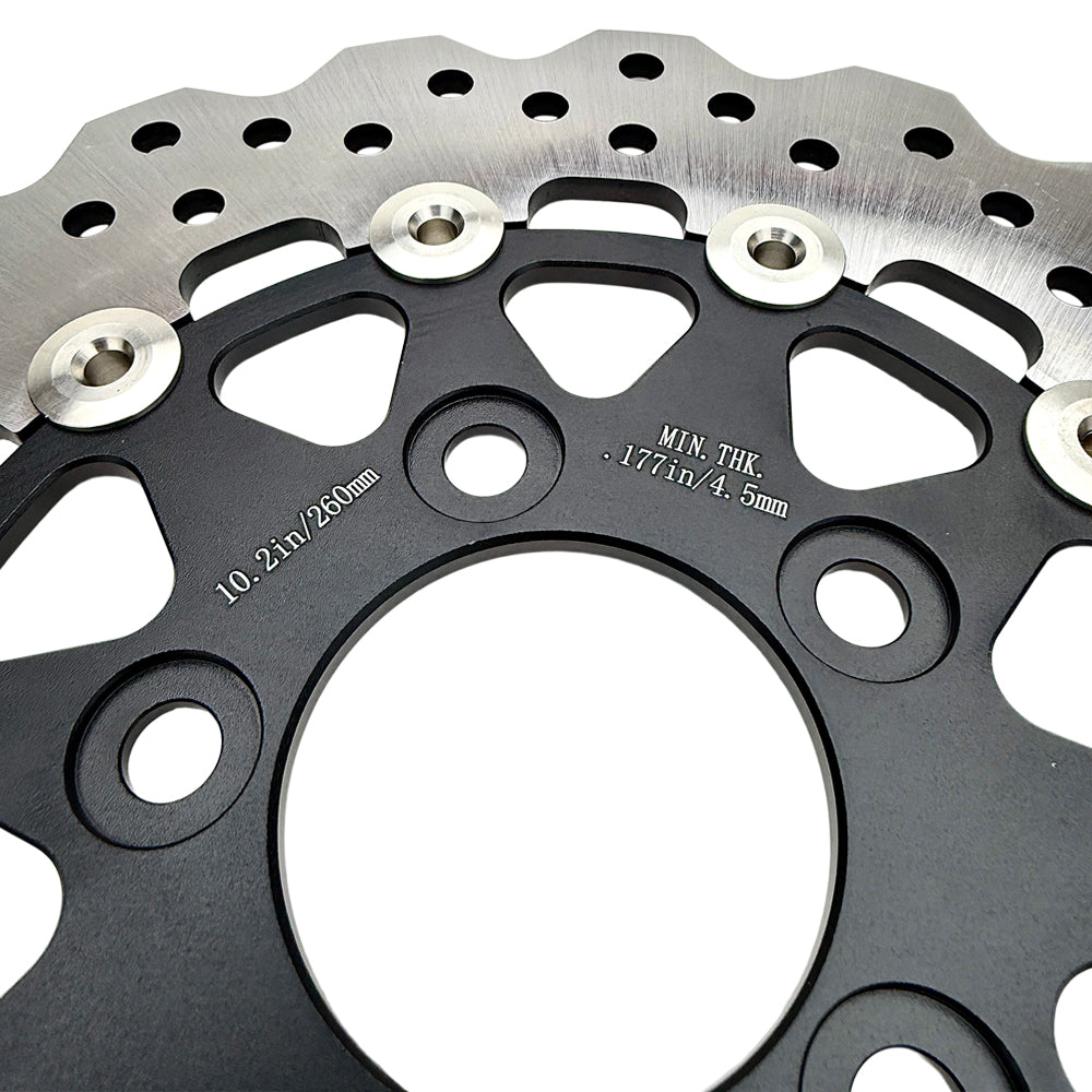 A close-up shows the TC Bros. 10.25" Rear Floating Brake Rotor for 2022-Up Harley-Davidson Nightster, featuring a metal rotor with a black hub and multiple drilled holes—ideal as a rear upgrade for your bike.