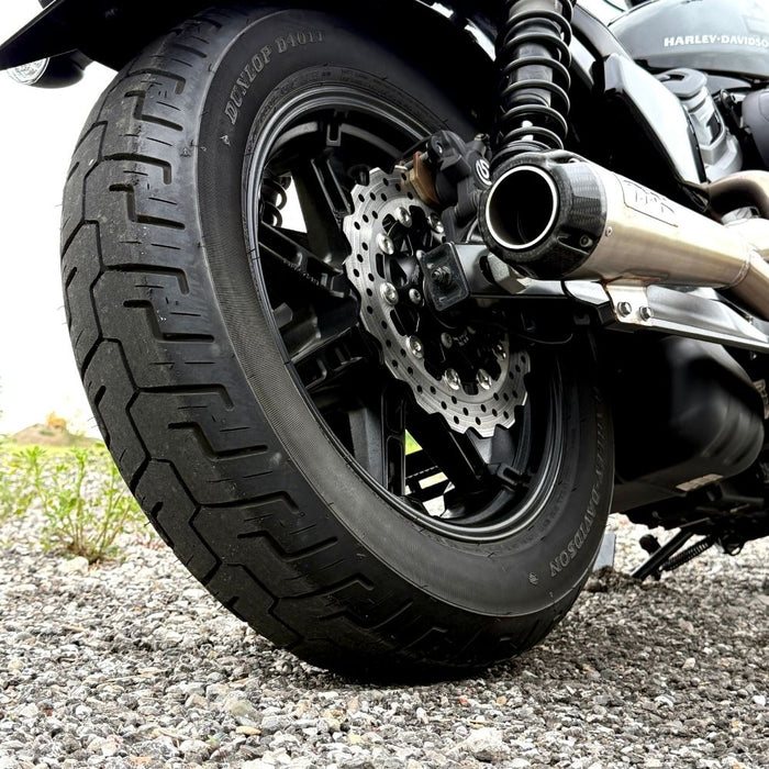 A close-up of the TC Bros. 10.25" Floating Rear Rotor, featuring a perforated metal disc with a black hub and silver ring, designed for 2022-Up Harley-Davidson Nightster rear brakes.