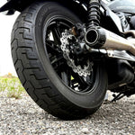 A close-up of the TC Bros. 10.25" Floating Rear Rotor, featuring a perforated metal disc with a black hub and silver ring, designed for 2022-Up Harley-Davidson Nightster rear brakes.