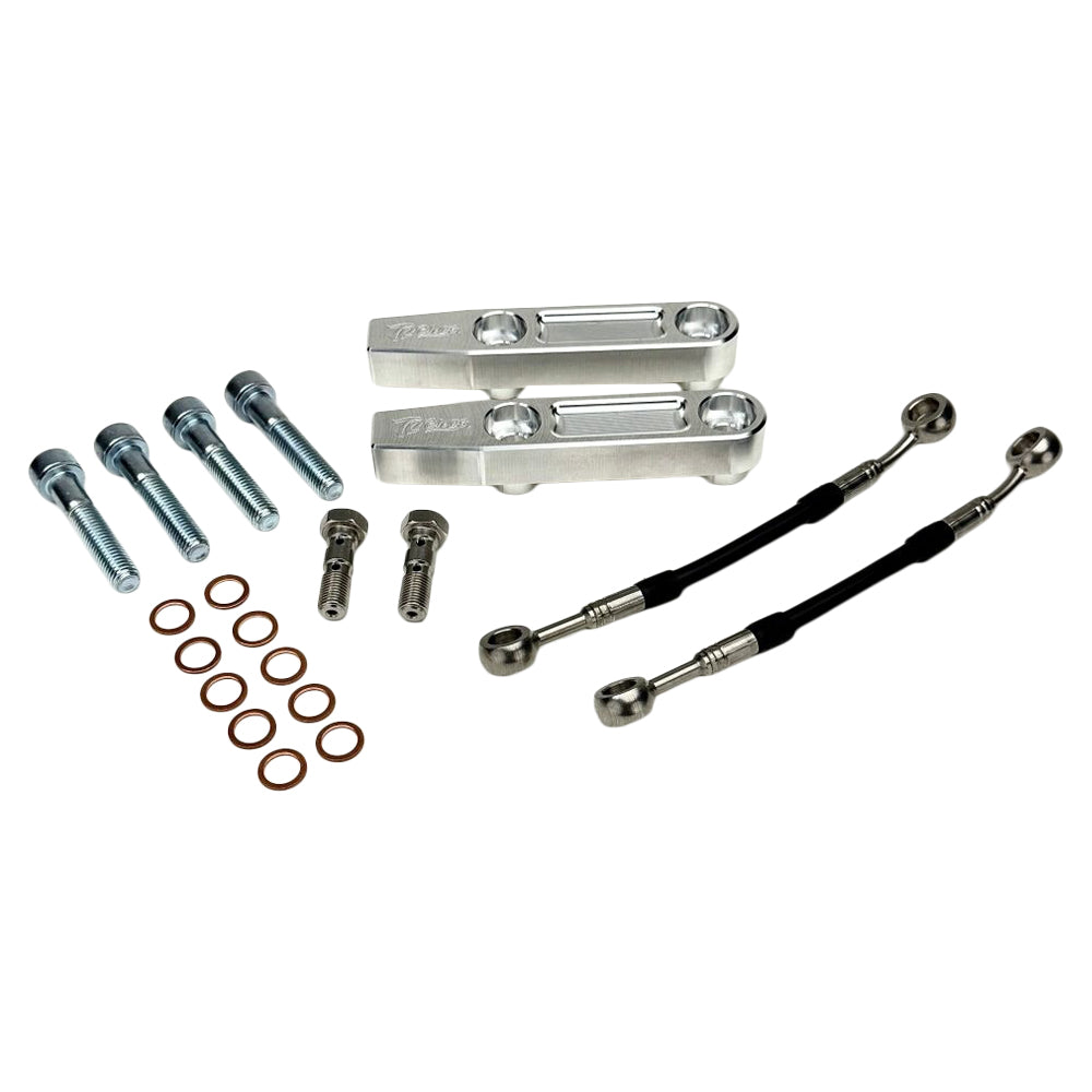 The TC Bros. Pro Series Radial Caliper Brake Line Kit for Harley Touring 2014-2023 includes silver and black bolts, washers, spacers, and two braided hoses with metal connectors, all arranged on a white background. Brand: TC Bros.