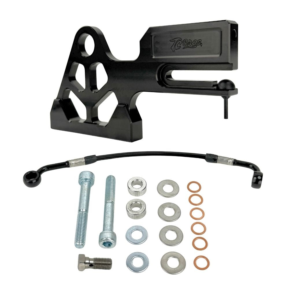 TC Bros. Pro Series Rear Radial Brake Bracket for 2018-Up Harley-Davidson M8 Softail, by TC Bros. Shown in black metal with multiple mounting holes, the kit includes a small attached hose, two bolts, a screw, washers, and copper rings—all arranged below on a white background—ideal for radial caliper conversion.