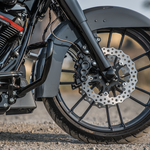 Four Arlen Ness Ness-Tech Differential Bore Front Calipers for 2008-Up Harley-Davidson, two in black and two in chrome, shown from different angles.