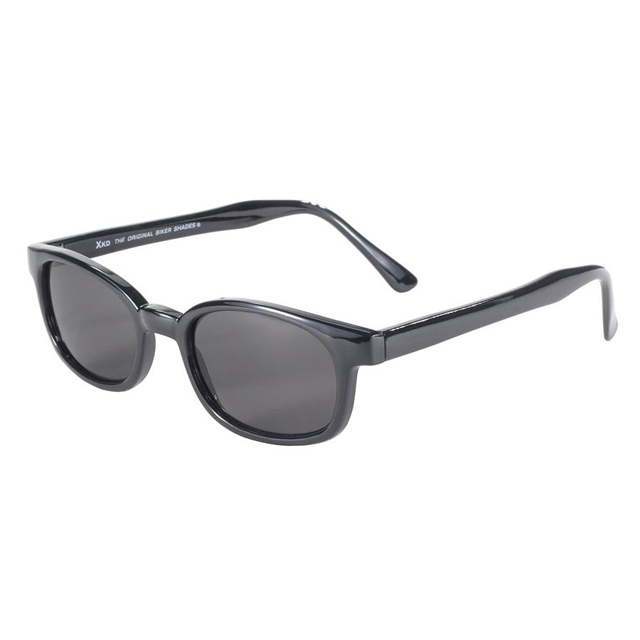 KD's XL Sunglasses - Smoke by KD's Sunglasses with dark lenses and a glossy finish, displayed on a white background. The frame is thick and solid, featuring slightly curved arms. Additionally, they offer UV protection to keep your eyes safe from the sun’s harsh rays.