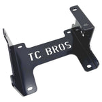 Black metal TC Bros. Engine Stand for 1999-2017 Harley-Davidson Twin Cam A motors, Touring, and Dyna; features "TC BROS" cutout and multiple mounting holes for secure installation.