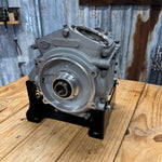 Black metal TC Bros. Engine Stand for 1999-2017 Harley-Davidson Twin Cam A motors, Touring, and Dyna; features "TC BROS" cutout and multiple mounting holes for secure installation.