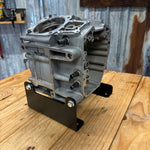 Black metal TC Bros. Engine Stand for 1999-2017 Harley-Davidson Twin Cam A motors, Touring, and Dyna; features "TC BROS" cutout and multiple mounting holes for secure installation.