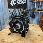 The TC Bros. Engine Stand for 2017-up Harley Milwaukee Eight Motor Bagger and M8 Softail features a black metal bracket with "TC BROS" cutout, upright tabs, and base mounting holes—perfect for securely holding your engine.