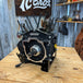 The TC Bros. Engine Stand for 2017-up Harley Milwaukee Eight Motor Bagger and M8 Softail features a black metal bracket with "TC BROS" cutout, upright tabs, and base mounting holes—perfect for securely holding your engine.