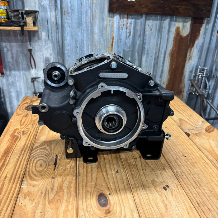 TC Bros. Engine Stand for 2000-2017 Harley-Davidson Twin Cam B Motor For Softail is a durable black metal bracket with multiple holes and "TC BROS" cutout, ideal for convenient engine maintenance. Photographed on a white background.