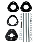 The TC Bros. Shock Spring Compressor for 2018-Up Harley-Davidson M8 Softail includes black metal spacers, bolts, washers, and nuts—perfect for safe shock absorber installation and maintenance.