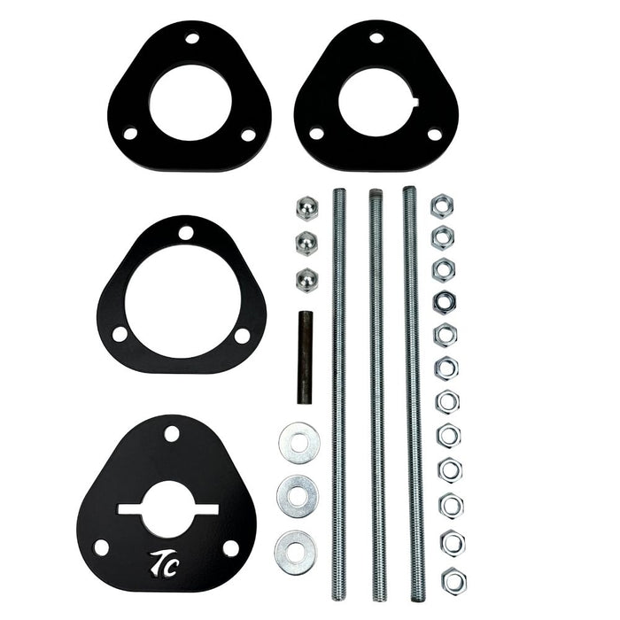 The TC Bros. Shock Spring Compressor for 2018-Up Harley-Davidson M8 Softail includes black metal spacers, bolts, washers, and nuts—perfect for safe shock absorber installation and maintenance.