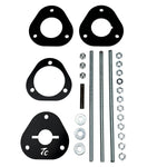 The TC Bros. Shock Spring Compressor for 2018-Up Harley-Davidson M8 Softail includes black metal spacers, bolts, washers, and nuts—perfect for safe shock absorber installation and maintenance.