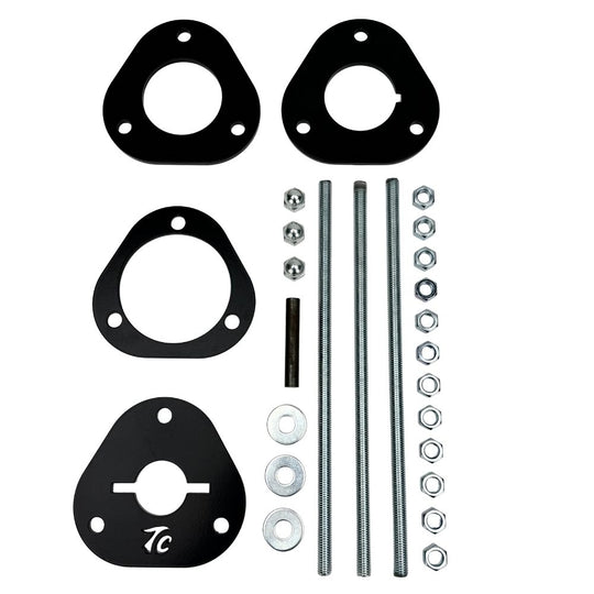 The TC Bros. Shock Spring Compressor for 2018-Up Harley-Davidson M8 Softail includes black metal spacers, bolts, washers, and nuts—perfect for safe shock absorber installation and maintenance.